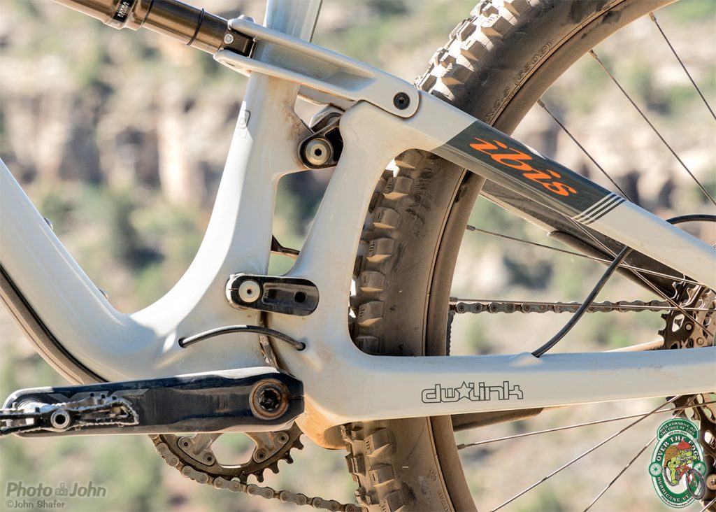 A non-drive side detail photo of the DW Link suspension on the Ibis Mojo 4 mountain bike. 