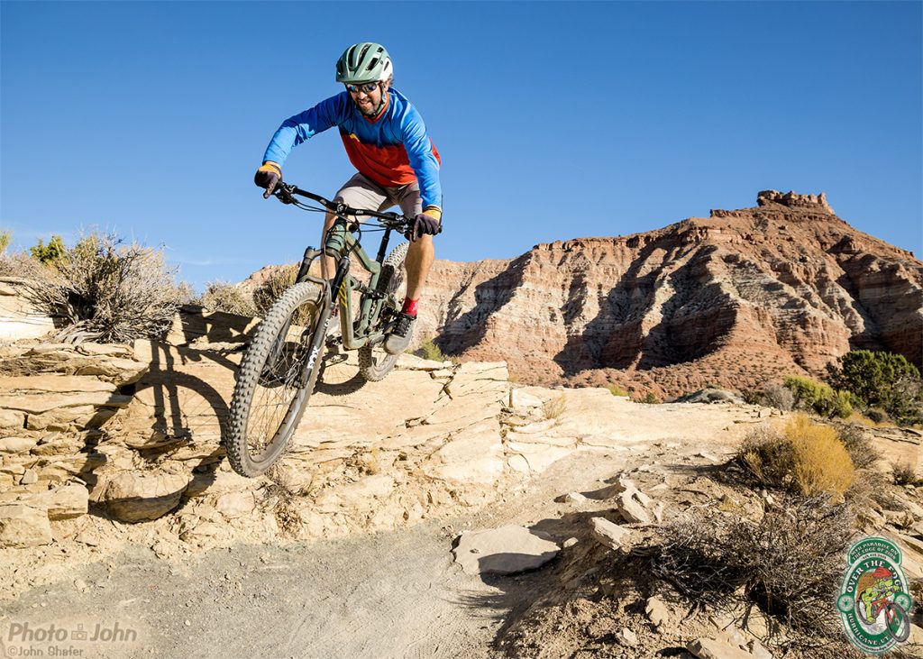 A mountain biker jumping in the Southern Utah desert. 