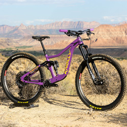 Thumbnail photo of a purple Knolly Fugitive mountain bike in a Southern Utah desert landscape.